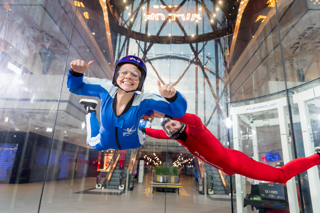 Woman smiling at the camera start of an high flight